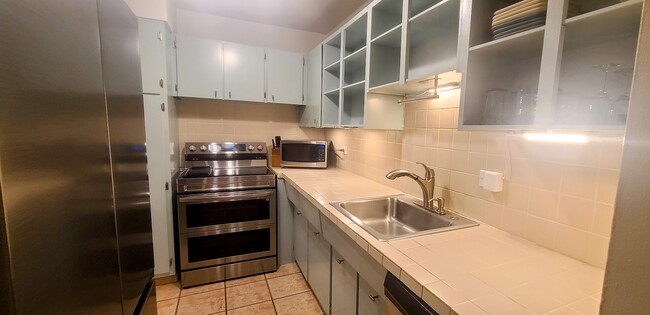 All cabinetry just painted and under-cabinetry lighting installed. - 3 Island Ave