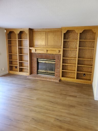 Fireplace and bookcase in family room - 2040 Goldenrod Ln