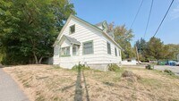 Building Photo - 4 bdrm/1 bath house with garage + large ya...