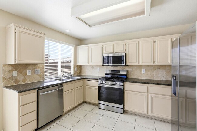 Building Photo - 4 bedroom with NO HOA! New Appliances & New Carpet!