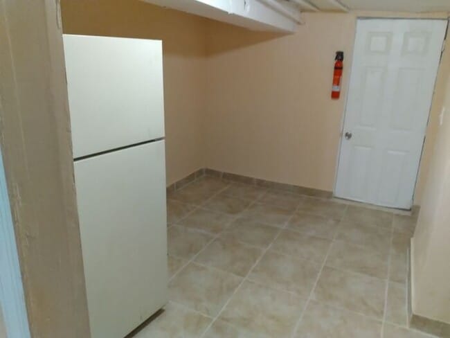 Building Photo - 3 bedrooms on the 3rd Floor with Central Hot Air, and an Available backyard