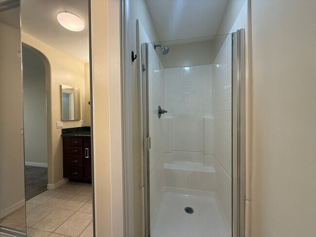 Building Photo - Upgraded Condo with Private Patio, AC, Pool, Gym, and Covered Parking in Gated Community
