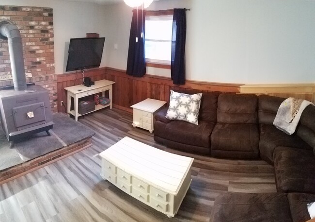 Downstairs Living room with wood stove - 94 Brookside Dr