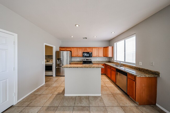 Building Photo - Welcome to this spacious 4 bedroom, 2.5 ba...