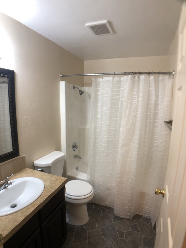 Bathroom with tub and shower - 2403 s kimball ave