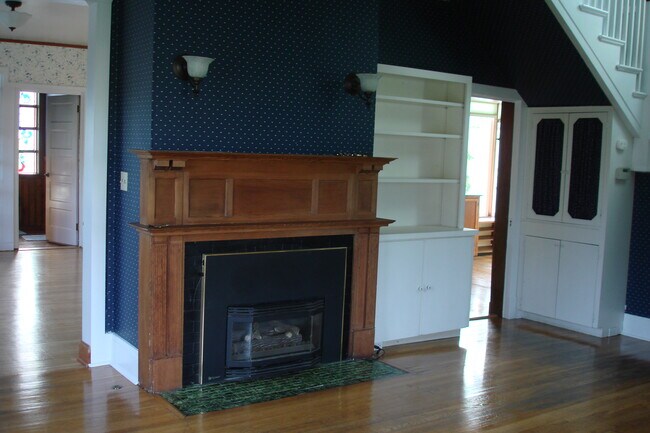 Living Room, Fireplace with gas log, entrance to kitchen on right, dining on left - 3402 N 28th St