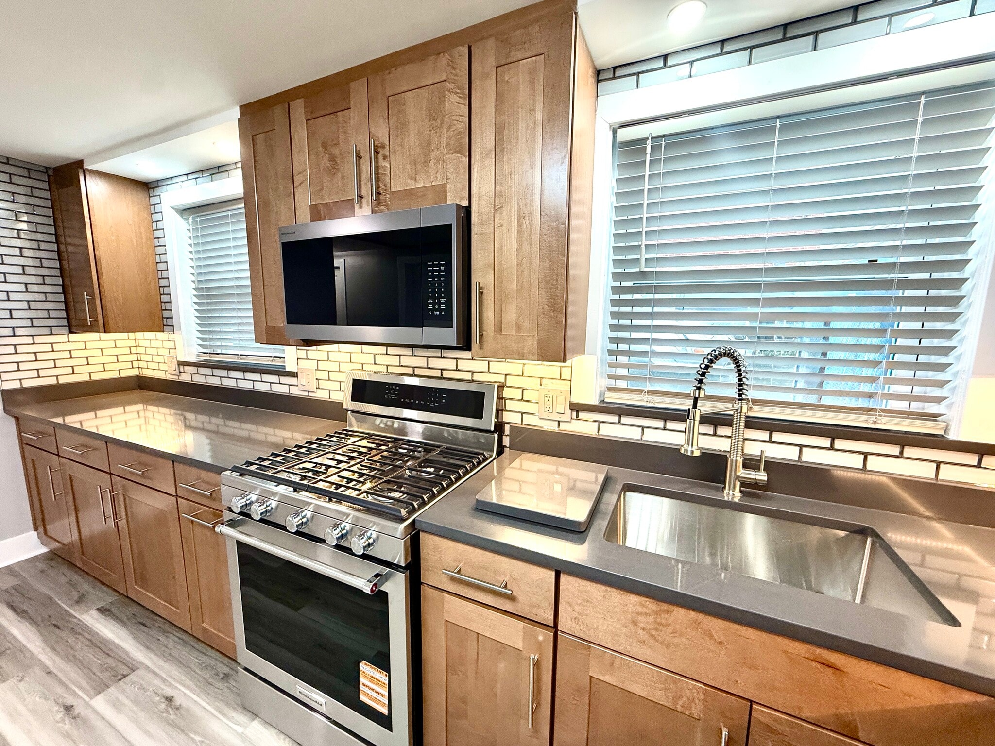 Plenty of counter space in quartz counters. Microwave vents outside. - 16W671 56th St