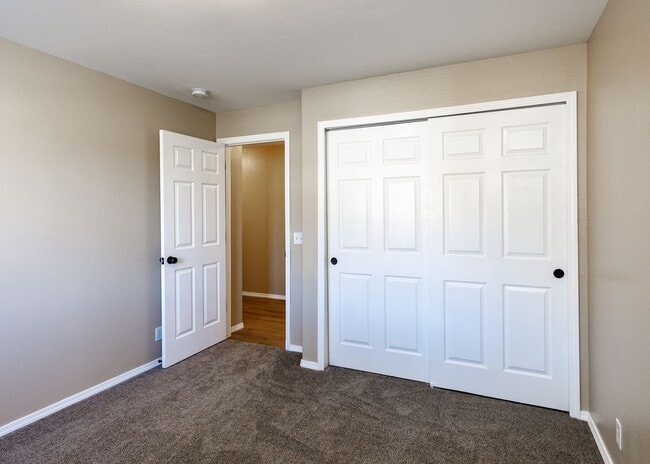 Building Photo - 3 Bed Top Floor Condo near Ft. Carson in Gated Community with detached Garage