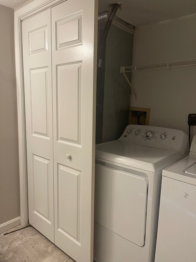 Laundry Closet in Lower Level Powder Room - 7897 W End Dr