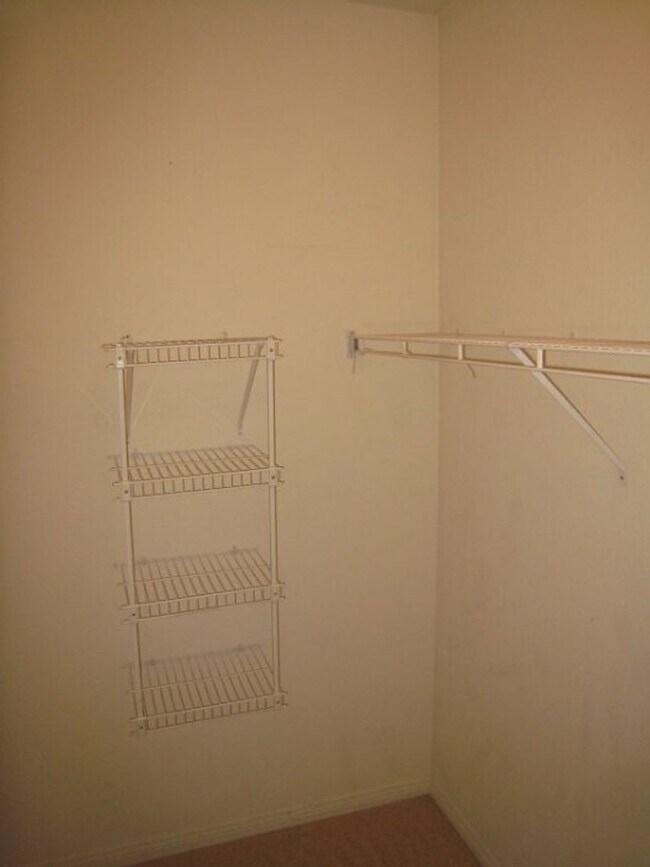 Building Photo - 2nd Story Condo in gated community close to the pool.