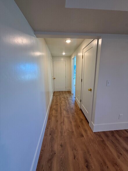 hallway to secondary bedroom with full bath on the right - 14 N 300 E
