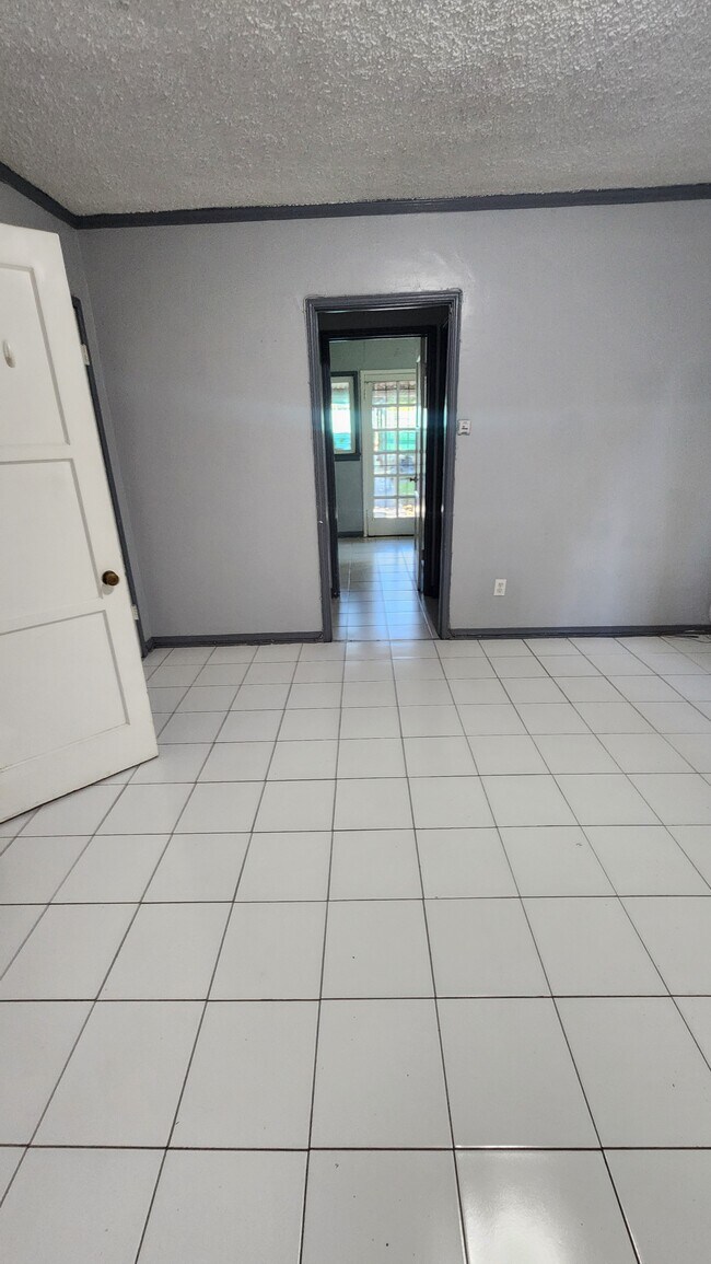 From living space to kitchen, bathroom and backyard entrance. - 116 S Dillon St