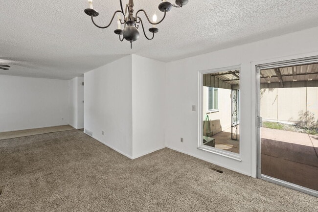 Building Photo - Close to Fort Carson and Cheyenne Mountain, 3 bedroom townhome with 2 car garage.