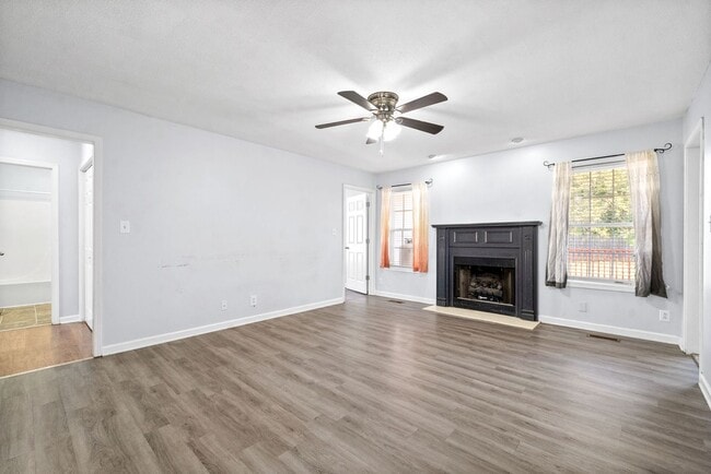 Building Photo - Adorable home with fenced back yard coming...