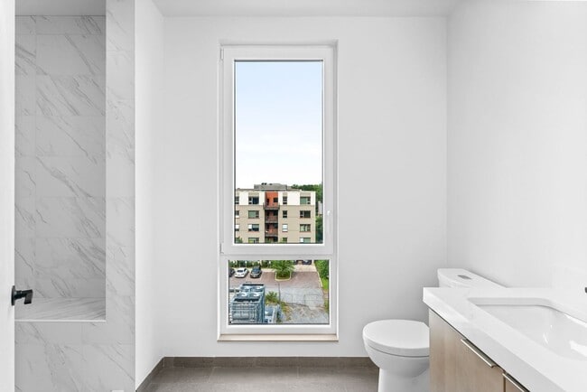 Building Photo - 2 Bedroom Corner-Unit with Wooded Balcony ...