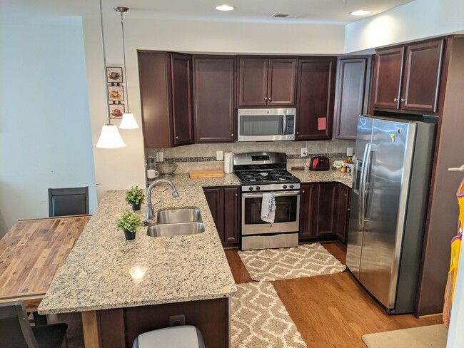 Building Photo - Bottom level (two story) *END UNIT* condo ...