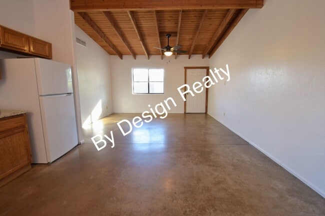 Building Photo - Charming Mid-Century Style: Vaulted Beams & Private Oversized Yard