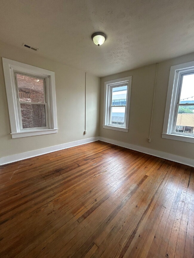 Building Photo - July Only- Submit your application this month and pay a reduced application fee of just $32.  1 B...