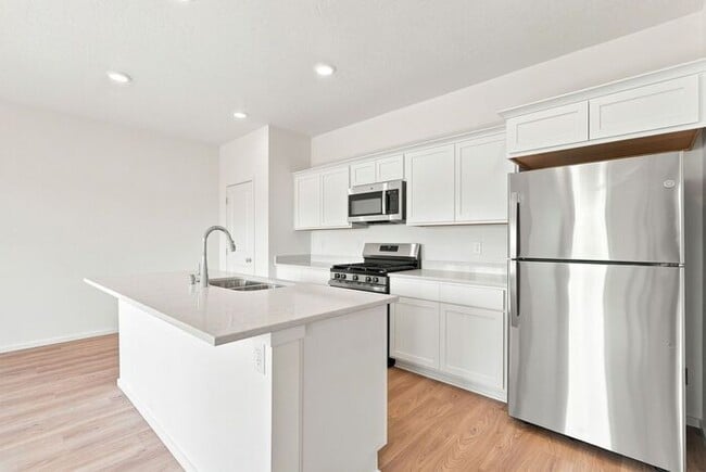 Building Photo - Modern 4-Bedroom Home with a 3-Car Garage & Covered Patio