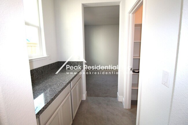 Building Photo - 4 br, 3 bath House - 8200 Triplefin Way