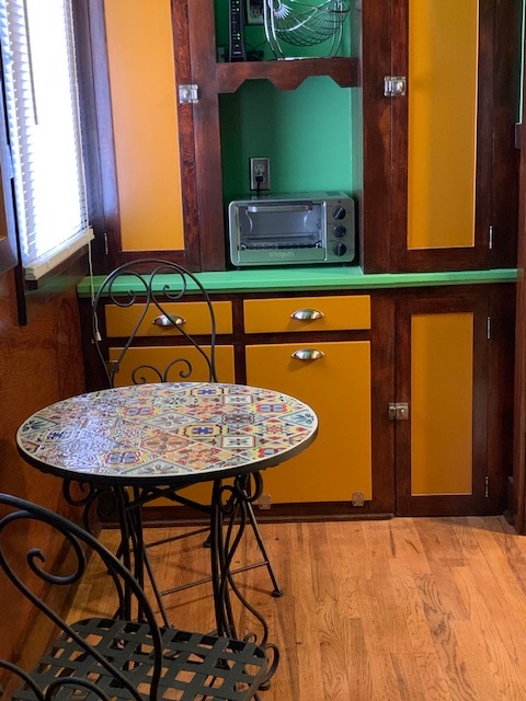 Mosaic tile bistro table in kitchen looking out to large backyard - 412 Carlisle Blvd NE