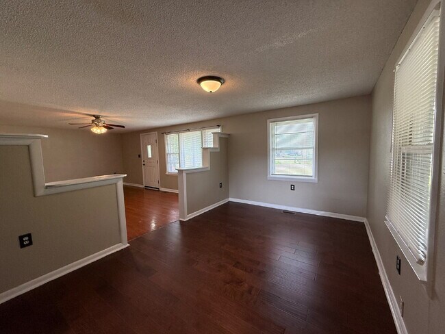 Building Photo - Will consider Section 8 "Charming 4-Bedroom Home with Hardwood Floors on Ready Section Road!"
