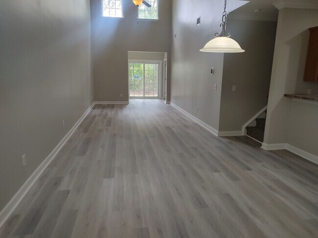 Building Photo - BRAND NEW FLOORING & FRESH PAINT - 3 Bedroom/2.5 Bath Townhome with garage in Wild Wing!