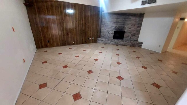 Family Room with Corner Fireplace and Accent Tiles - 5538 W Ridgecreek Dr