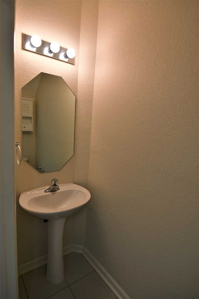 Half bathroom in living room area - 5036 SE Mariner Garden Cir