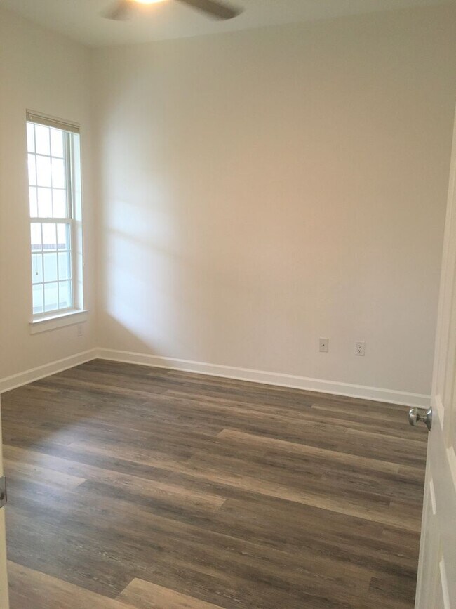 Building Photo - Inviting, modern two bedroom with garage parking, balcony views and a wonderful location in Chape...