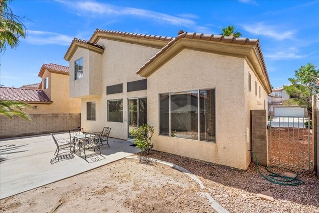 Building Photo - Contemporary Guard-Gated Retreat Near Rhodes Ranch Golf Club with Elegant Open-Concept Living