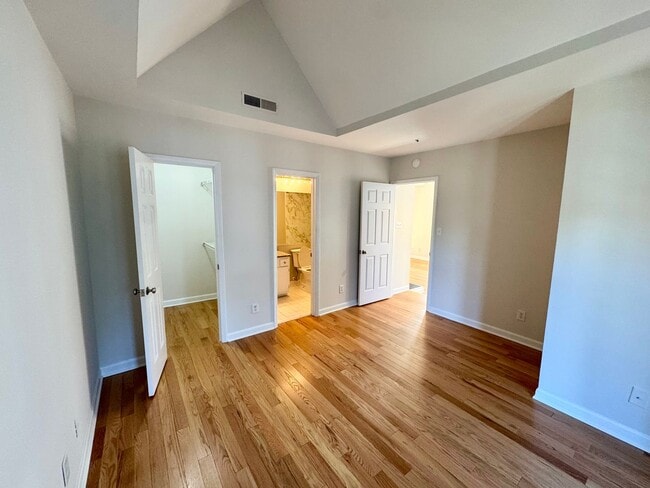 Building Photo - Top-Floor End Unit Condo at New Bern Place