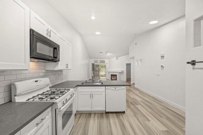 Building Photo - Charming and spacious single-story townhome nestled within a gated community in the desirable Nor...