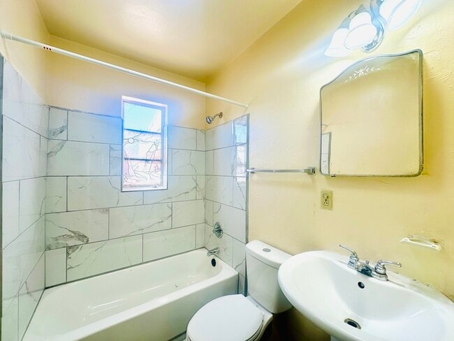 Building Photo - New Flooring! Spacious Private Yard with W...