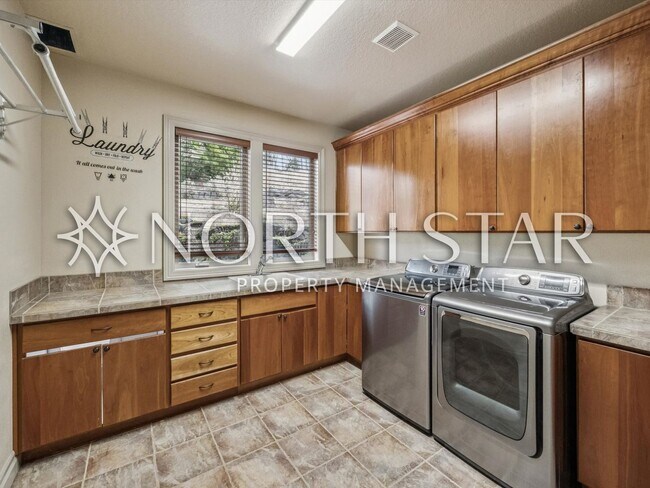 Building Photo - Elevated Forest Heights Retreat with Stunning Valley Views & Versatile Living Spaces