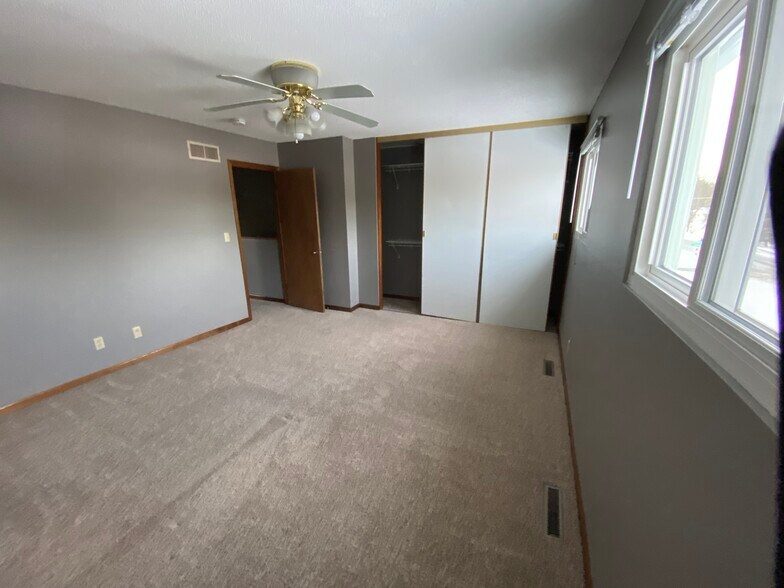 upstairs master bedroom with brand new carpet - 6387 15th St N