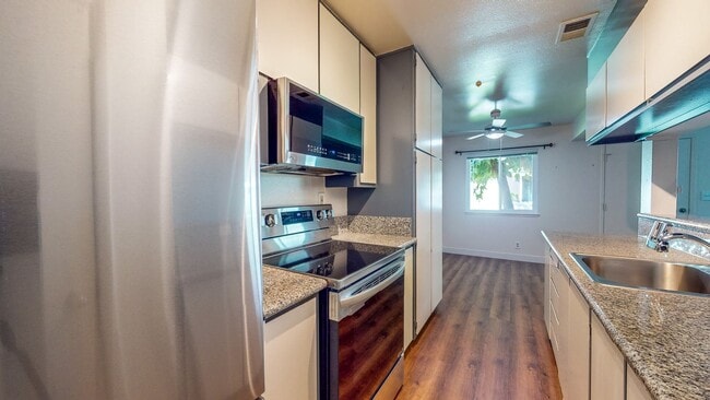 Building Photo - 2 story 2 bedroom 1 bath condo with covered parking, private storage and community pool!