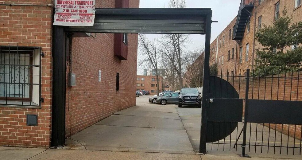 The parking lot entrance, with security gates, is just a few feet from your front door. - 516 S 12th St