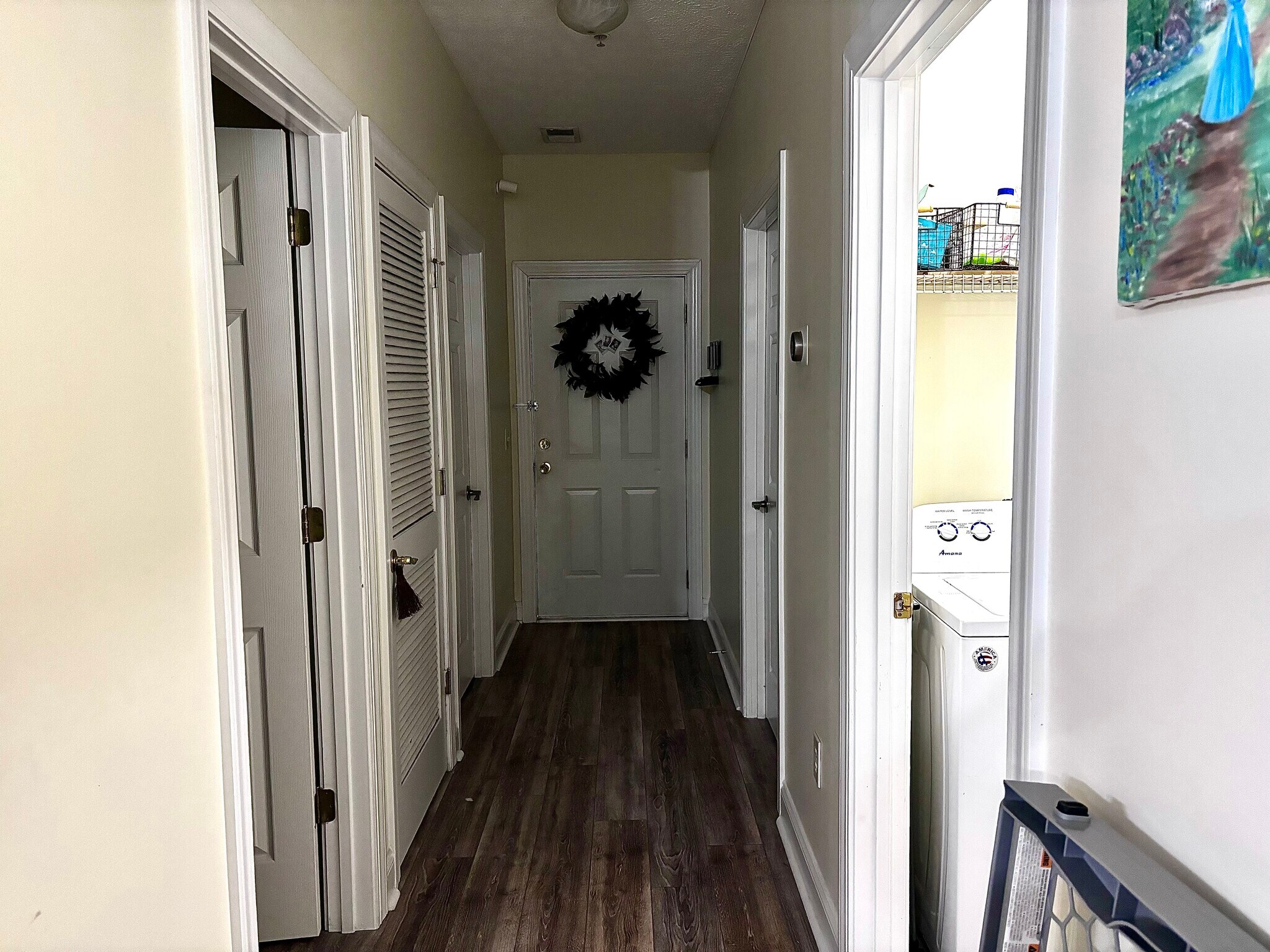 Entryway with 2 bedrooms, shared bathroom, and in unit laundry room - 111 Fountain Pointe Ln