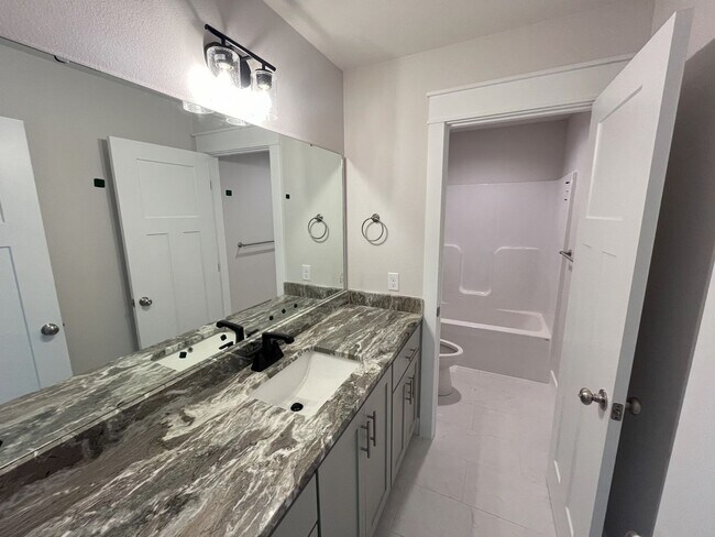 Building Photo - Nearly-new 4-bedroom, 2-bath home in the exclusive Lion's Gate Neighborhood!!!