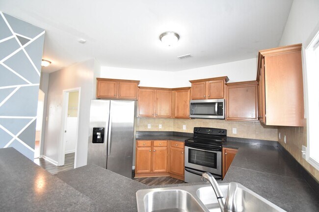 Building Photo - (Coming Soon)   4 Bedroom and 2.5 Bath Hom...