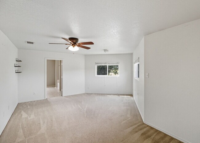 Building Photo - Incredible value with a **washer, dryer, refrigerator, shed, and a covered backyard with a dog run!