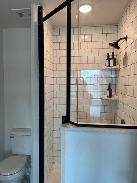 Clean up with your choice of shower or soaking tub in each two bedroom apartment - 221 E College St