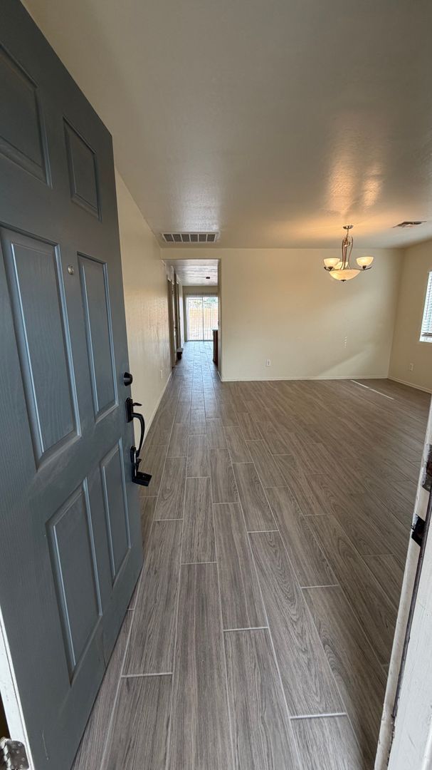 Building Photo - Two Story Home with NEW tile and a large backyard!