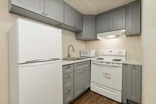 Kitchen with appliances - Badger Apartments