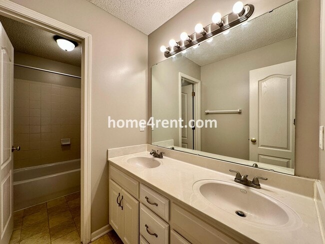 Building Photo - Beautiful Four-Bedroom Home with Three Car Garage, Wood Floors, Finished Basement and a Fenced Ya...