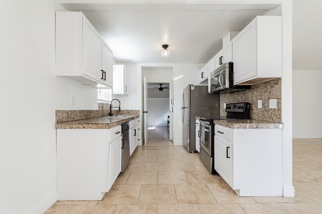 View of kitchen to flex room - 3112 La Mesa Dr
