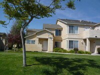 Building Photo - Fresh and Clean Upstairs Condo W/One Car Garage, Reduced Deposit