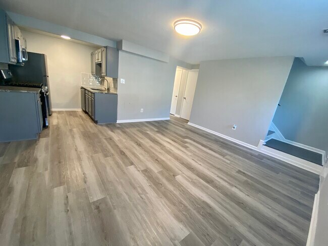 Open floor plan- living and dining area - 1861 Village Green Dr