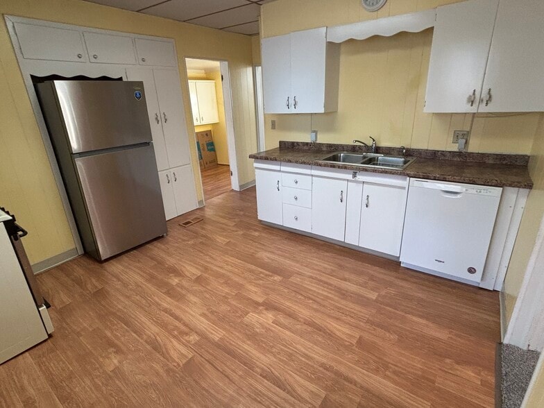 Kitchen with new fridge & microwave - 203 E McKinley St